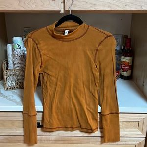 Free people fitted tee; mock turtleneck; accent stitching; small; excellent cond